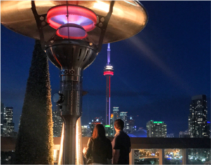evenglo heater in outside patio with the Toronto Skyline at night